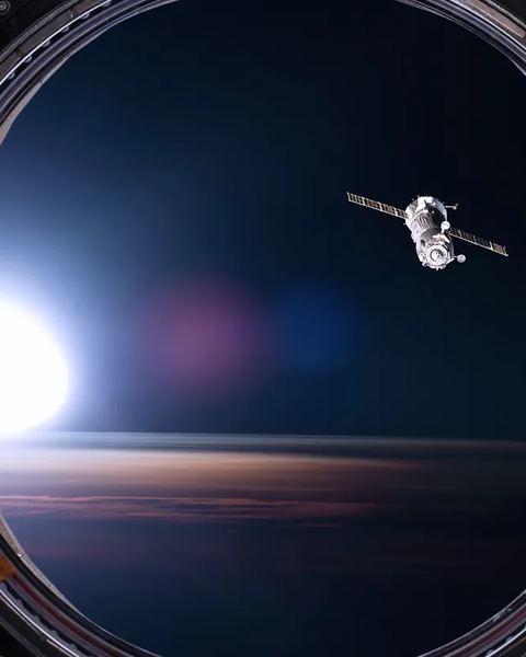 Spacecraft seen through a station window, space structure measurement